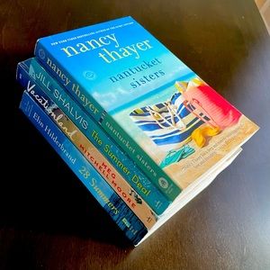 4 paperback beach read novels.